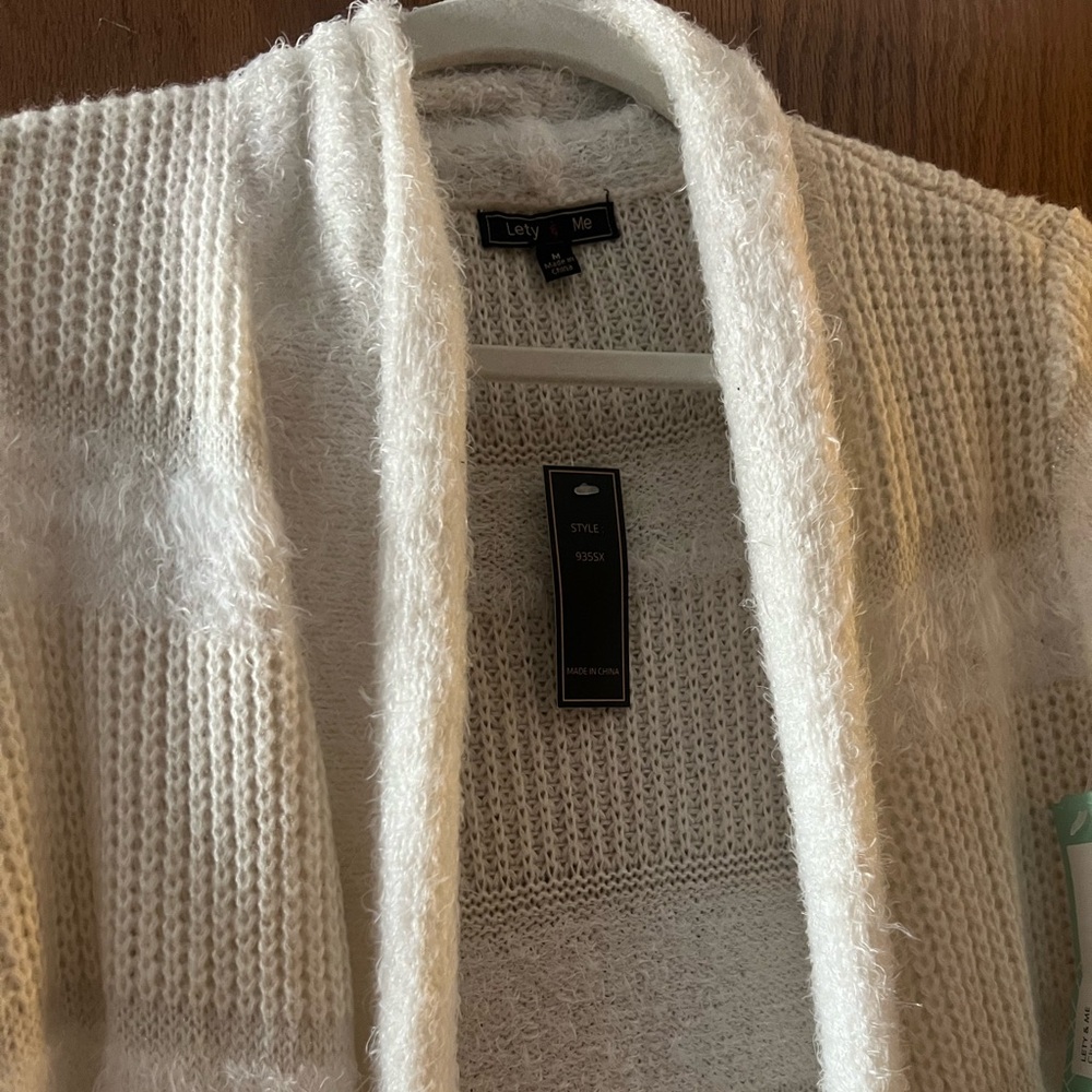 Brand new cream/white fun cardigan.